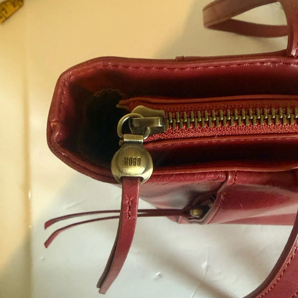 Hobo Cranberry Trapezoid Shoulder Bag w/Zipper Accent Gold Hardware Inner Pocket